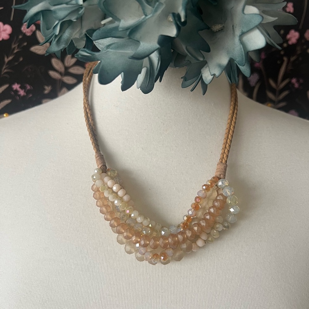 Braided leather strands with beads